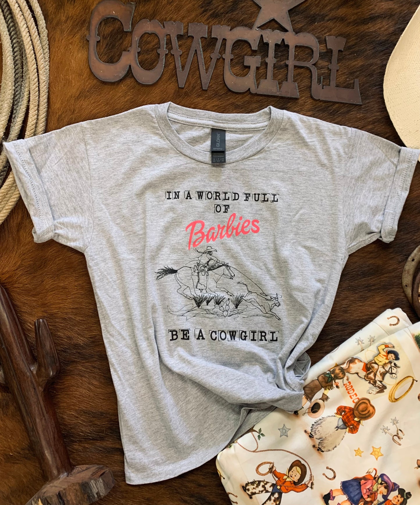 In A World Full Of Barbies Be A Cowgirl Youth Tee