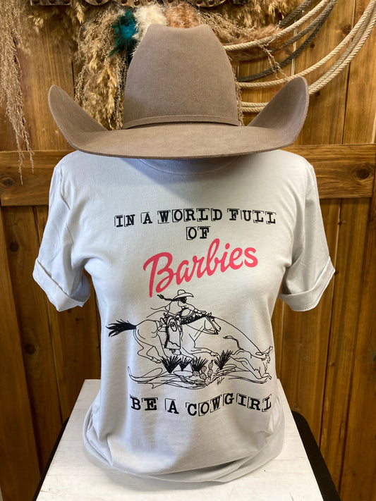 In A World Full of Barbies Be A Cowgirl Tee