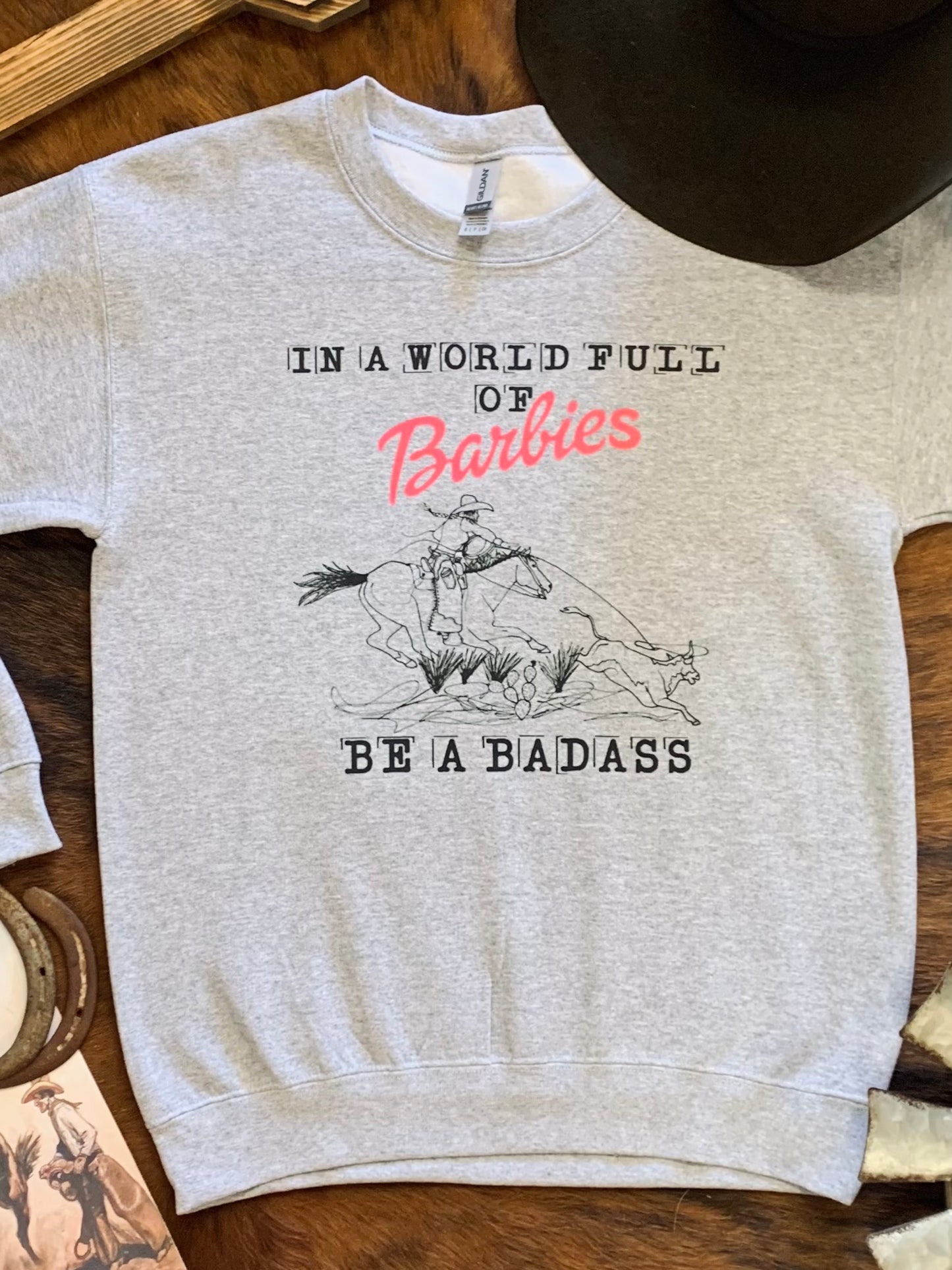 In A World Full of Barbies Be A Badass Crewneck Sweatshirt