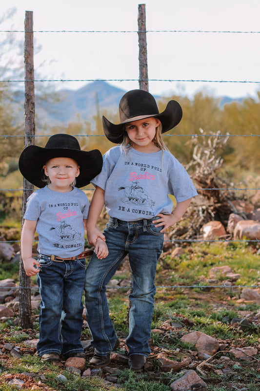 “In A World Full Of Barbies Be A Cowgirl" Youth Tee